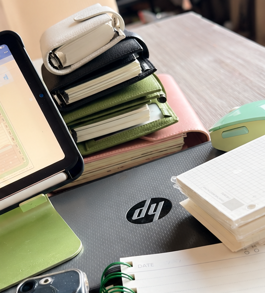 Laptop, iPad and planners on my work-from-home desk