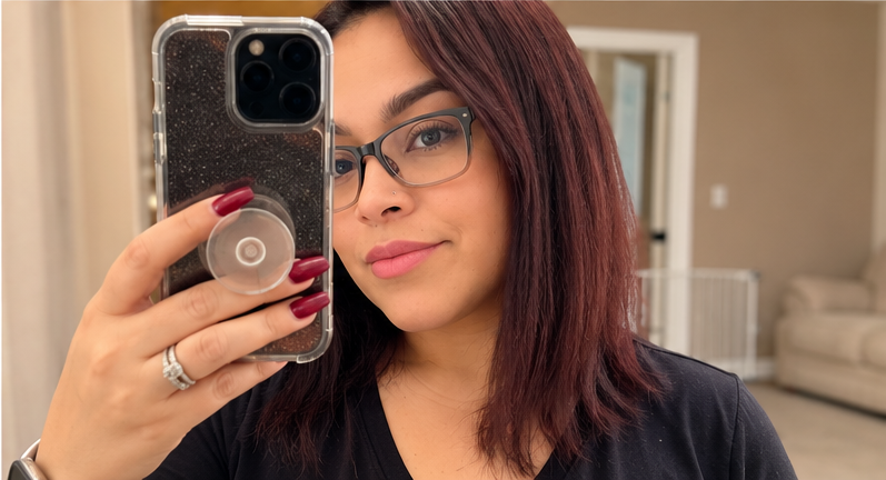 Lifestyle creator taking a casual mirror selfie at home
